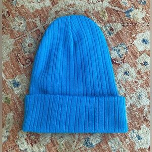 Brand new blue beanie hat. Fits small . Great for a small head or child !